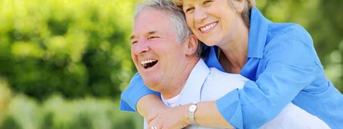 Older couple in park embracing